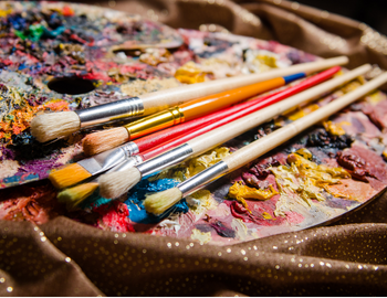image of art palette and paint brushes