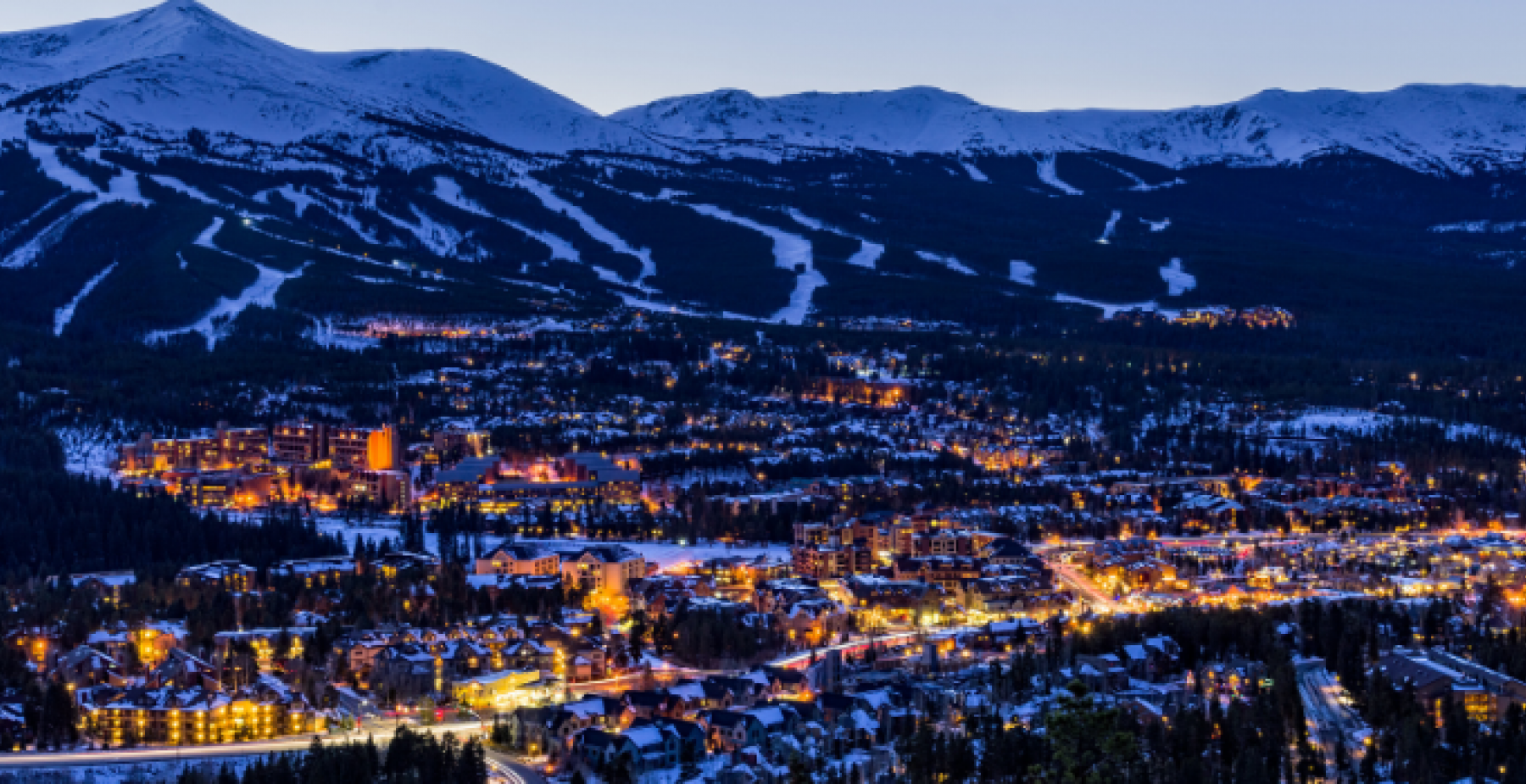 snowy Breckenridge downtown at night with mountain background