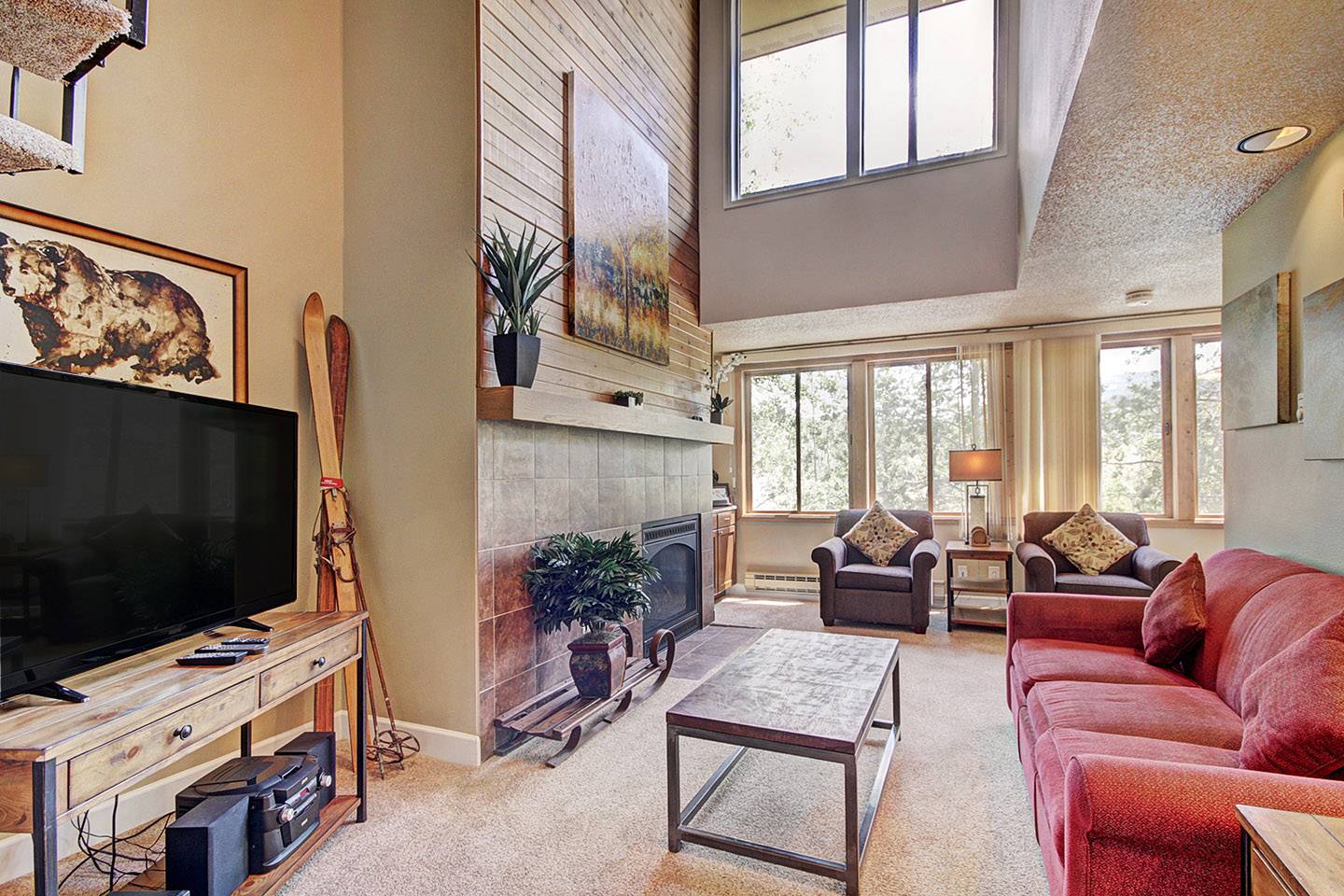 high ceilings and views in Ski Hill Condo living room.