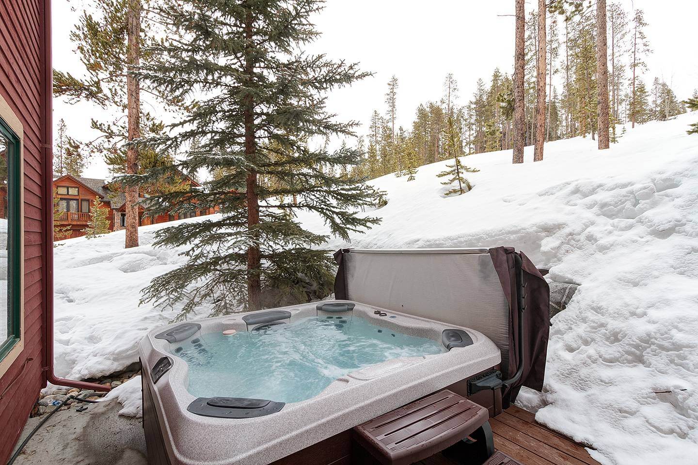 snowy hot tub view at twilight lookout vacation rental property in breckenridge